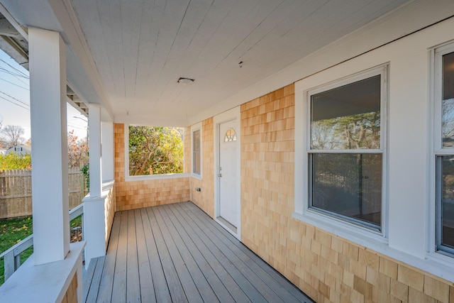 wooden terrace with a porch