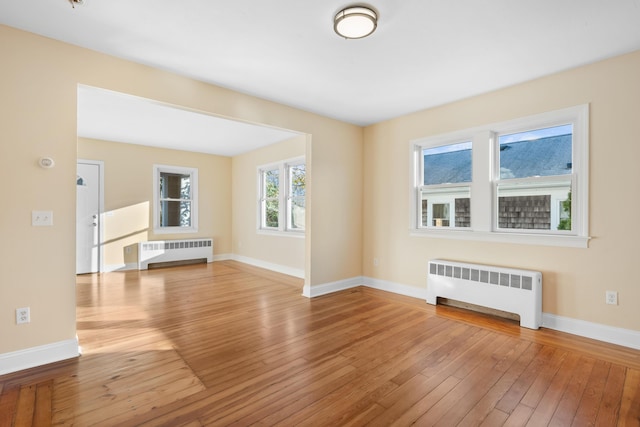 interior space featuring wood-type flooring and radiator