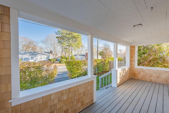 unfurnished sunroom featuring wooden ceiling