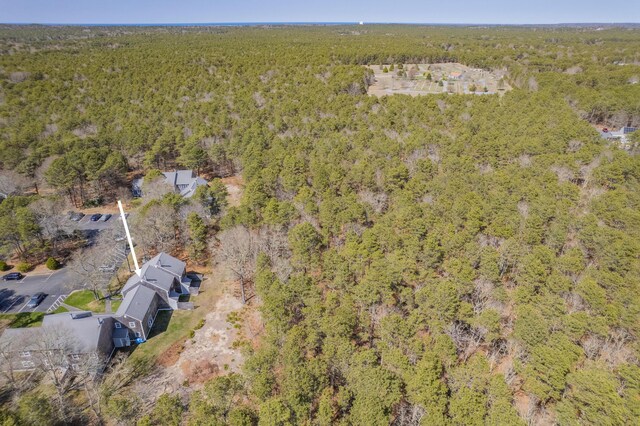 bird's eye view featuring a wooded view
