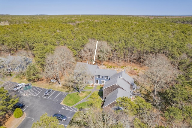 aerial view featuring a wooded view