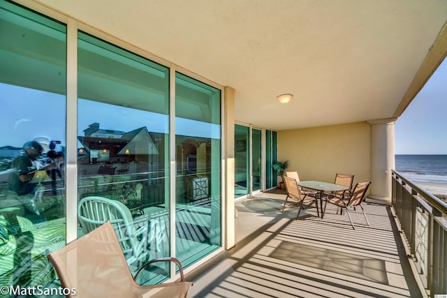 balcony featuring a water view