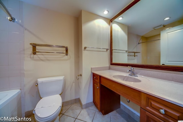 full bathroom featuring tiled shower / bath combo, vanity, tile patterned floors, and toilet