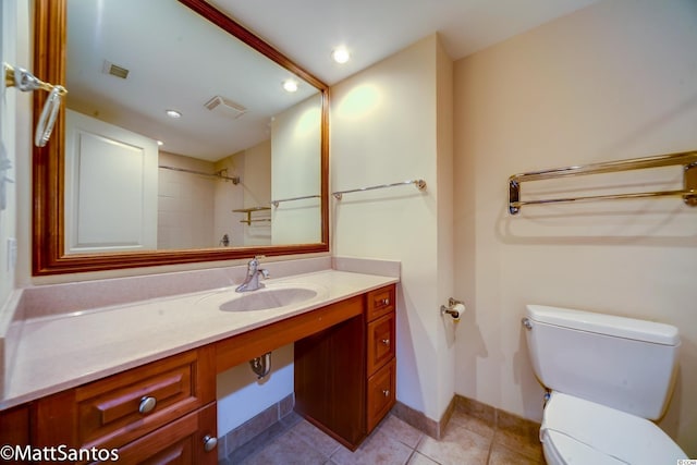 bathroom featuring walk in shower, tile patterned floors, vanity, and toilet