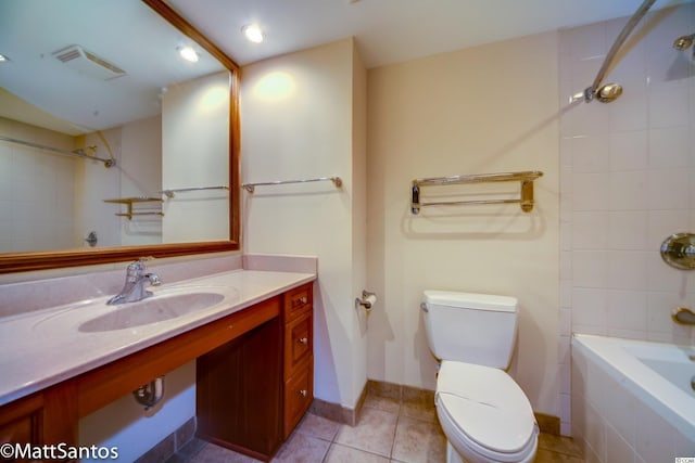 full bathroom with tile patterned flooring, vanity, toilet, and tiled shower / bath combo