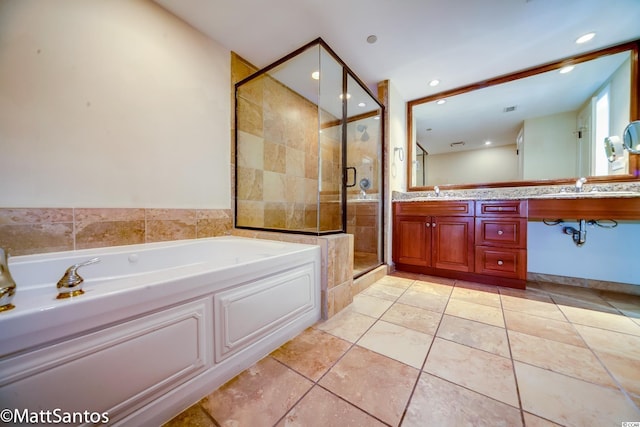 bathroom with vanity, plus walk in shower, and tile patterned floors