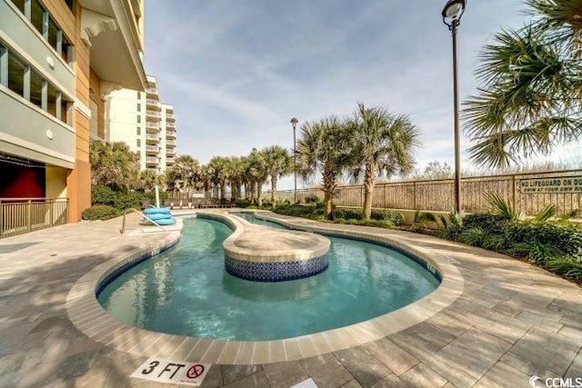 view of swimming pool featuring a patio