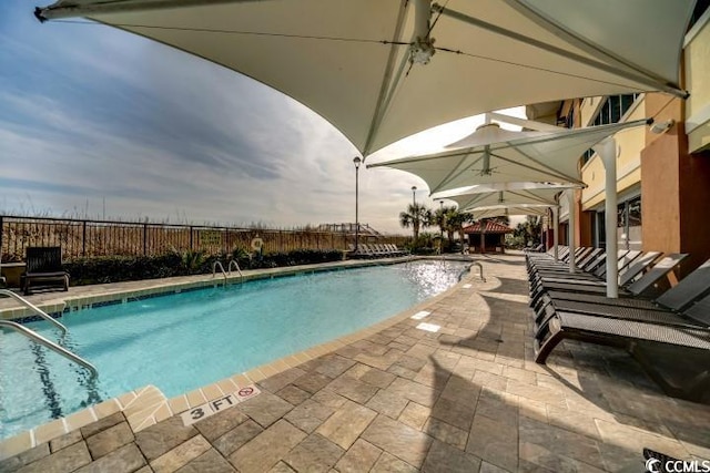 view of swimming pool featuring a patio