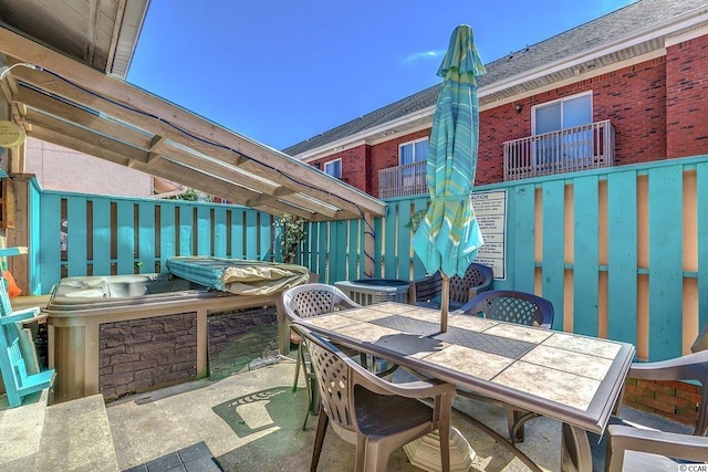 view of patio / terrace featuring a balcony and central AC unit