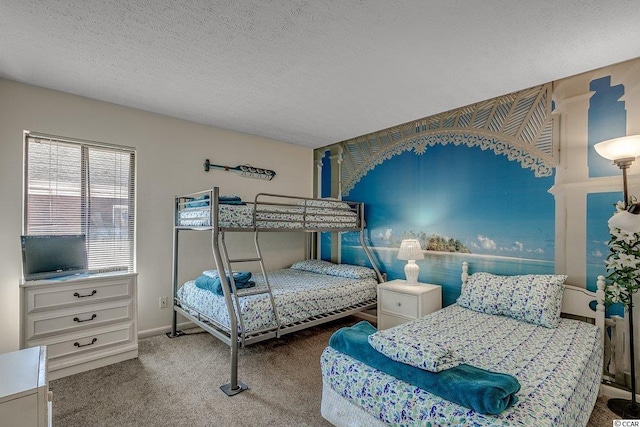 bedroom with dark colored carpet and a textured ceiling