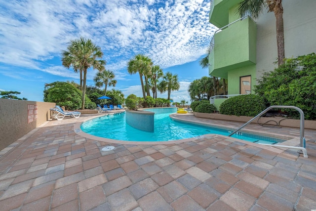 view of swimming pool with a patio