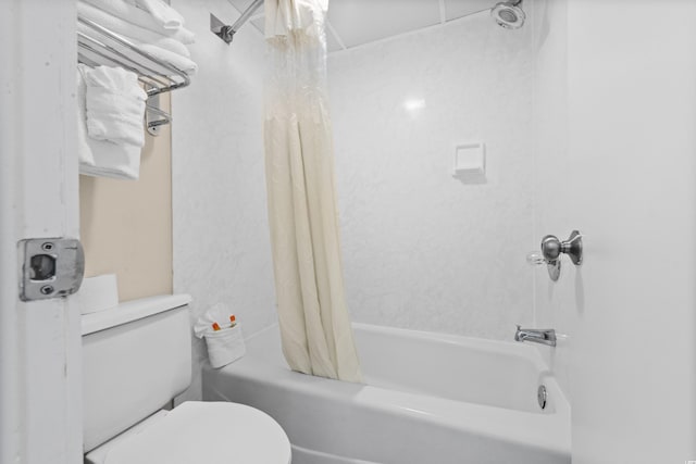 bathroom featuring toilet and shower / bath combo