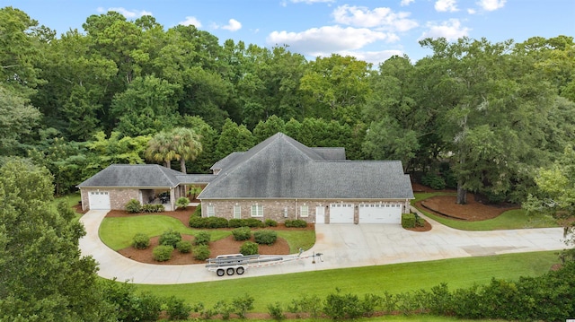 exterior space featuring a front lawn and a garage