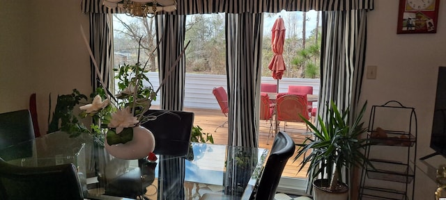 dining area featuring an inviting chandelier and a healthy amount of sunlight