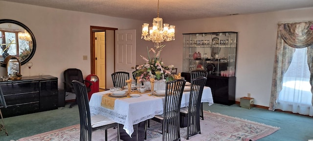 carpeted dining area with a textured ceiling and a notable chandelier