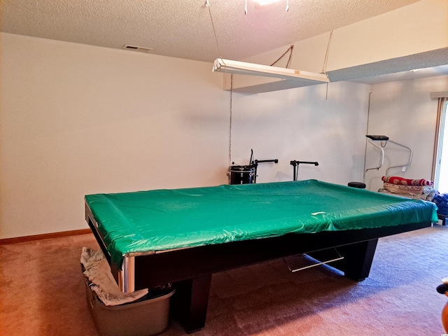 recreation room with carpet, a textured ceiling, and billiards