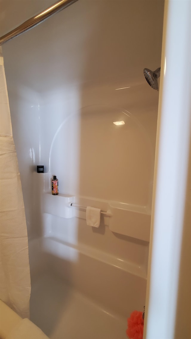 bathroom featuring shower / bath combination with curtain