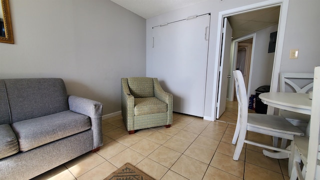 living area with light tile flooring