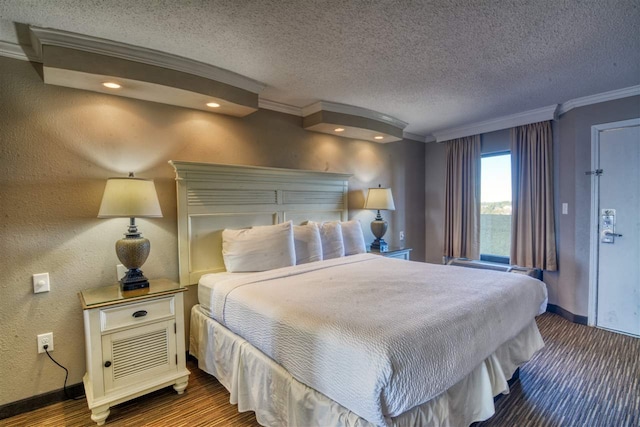 bedroom featuring ornamental molding and a textured ceiling