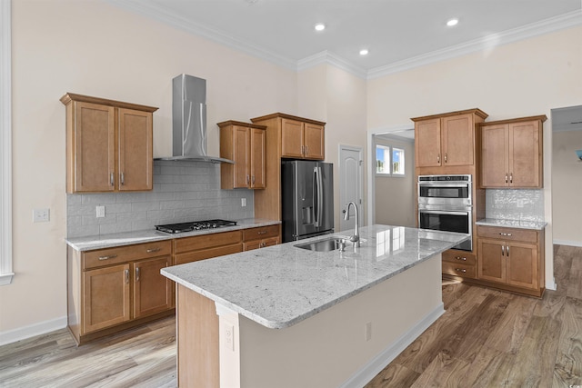 1228 Colusa Ct, Little River, SC 29566 - kitchen with wall chimney range hood, stainless steel appliances, brown cabinets, light wood finished floors, and crown molding