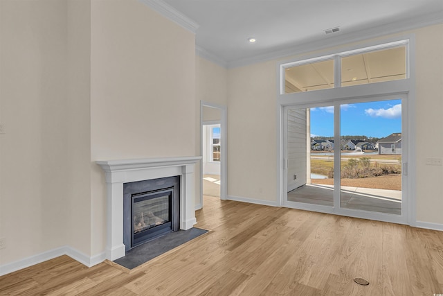 1228 Colusa Ct, Little River, SC 29566 - unfurnished living room featuring crown molding, light wood-style floors, a fireplace with flush hearth, and recessed lighting