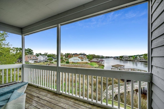 wooden deck featuring a water view