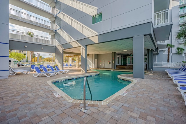 view of swimming pool with a patio