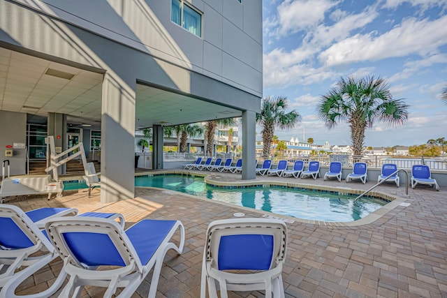 view of swimming pool featuring a patio