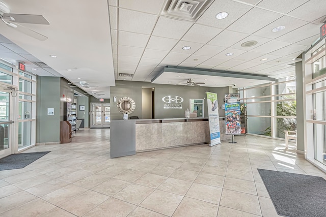 reception area with french doors and ceiling fan