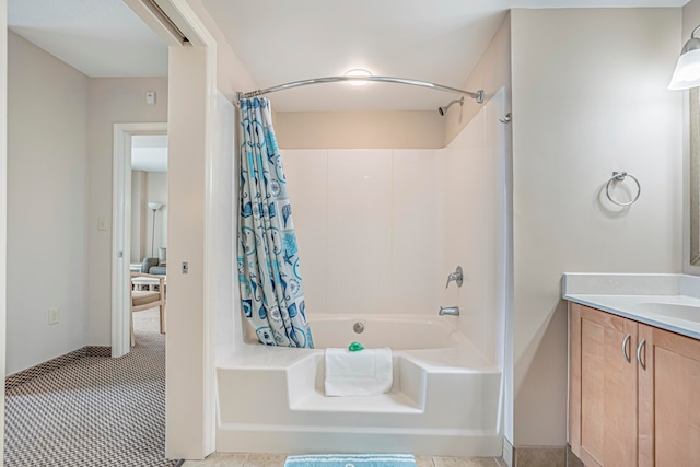 bathroom featuring vanity, shower / bath combination with curtain, and tile floors