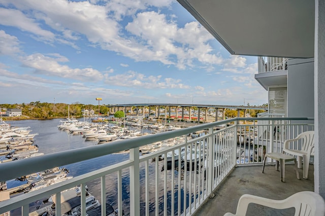 balcony featuring a water view