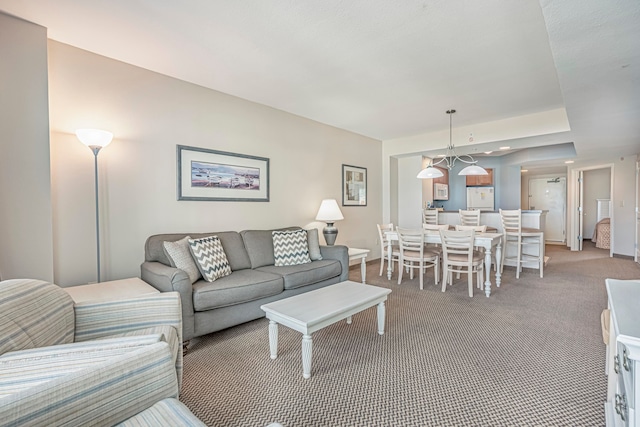 living room with dark colored carpet