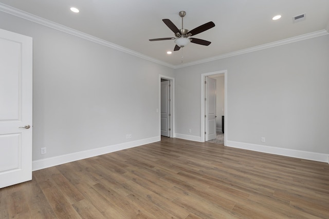 spare room featuring ceiling fan, crown molding, and hardwood / wood-style floors