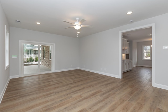 spare room with ceiling fan and light hardwood / wood-style floors