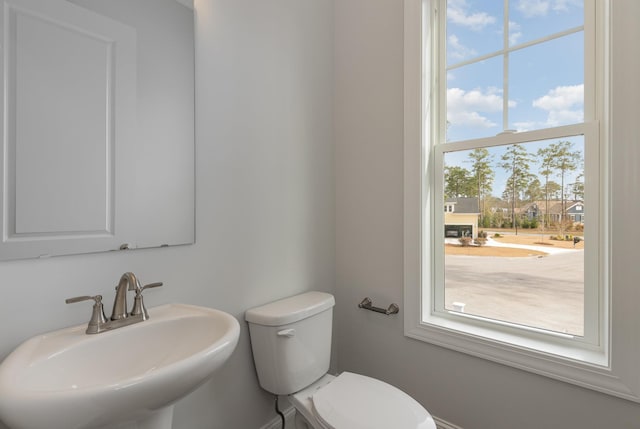 bathroom with toilet and sink