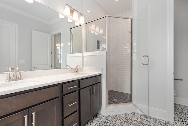 bathroom featuring toilet, walk in shower, crown molding, vanity, and tile patterned floors