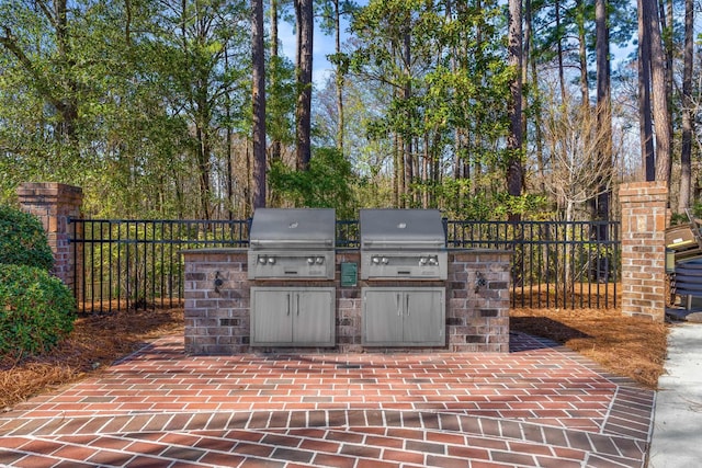 view of patio with an outdoor kitchen and grilling area