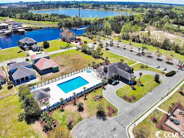 birds eye view of property with a water view