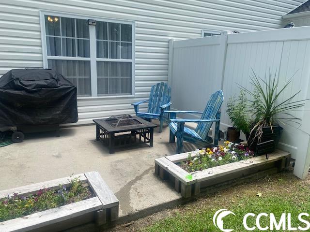 view of patio / terrace featuring a fire pit and area for grilling