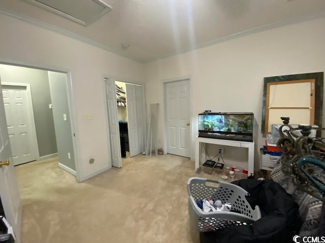 sitting room featuring light carpet and crown molding