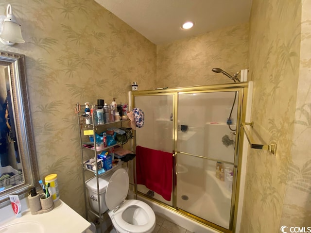 bathroom featuring walk in shower, tile floors, and toilet