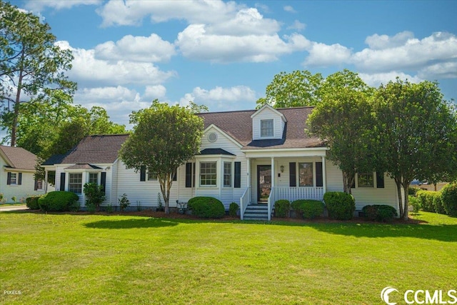 new england style home featuring a front yard