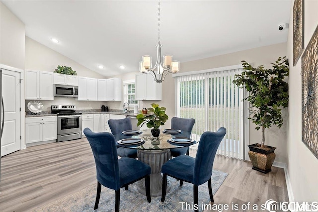 dining space featuring recessed lighting, light wood-style floors, a chandelier, and high vaulted ceiling