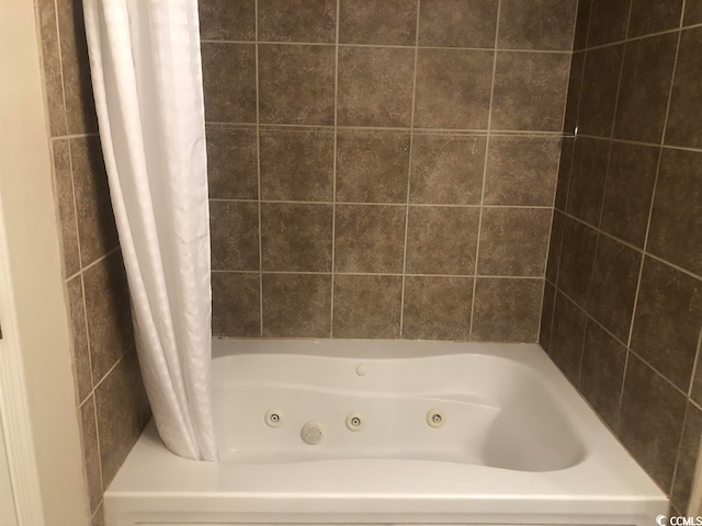 bathroom with shower / bath combination with curtain