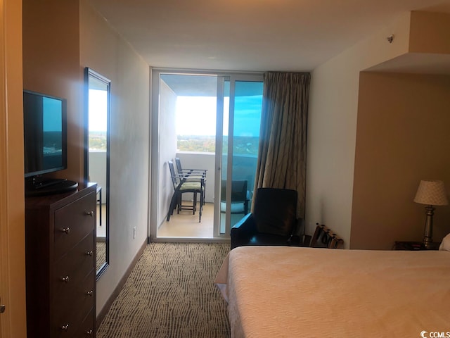 bedroom featuring carpet flooring and access to outside