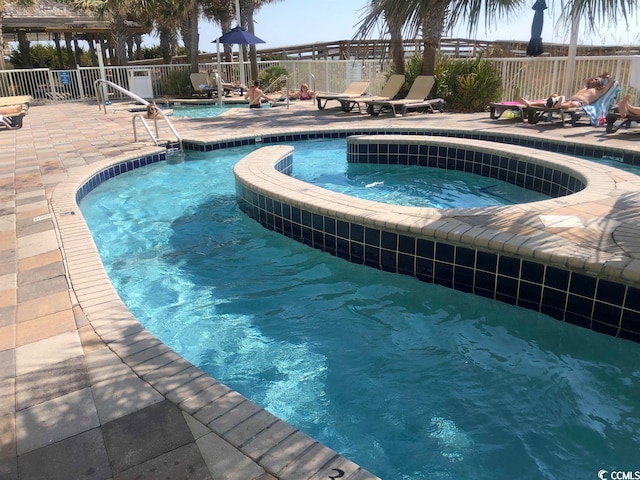 view of pool featuring a patio area