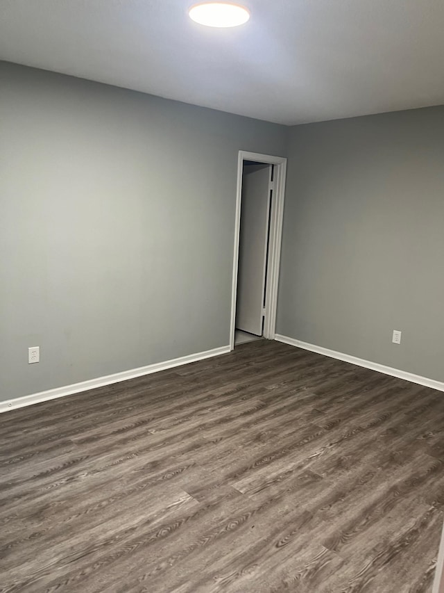 unfurnished room with hardwood / wood-style floors