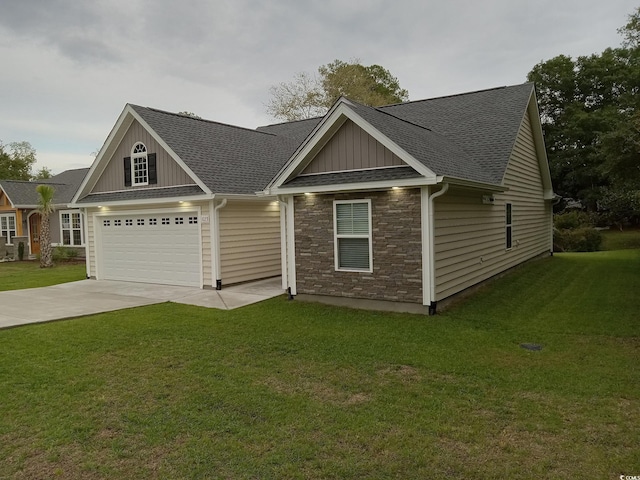1023 Meares St, Calabash, NC 28467 - view of front of home with a front yard, roof with shingles, driveway, and board and batten siding