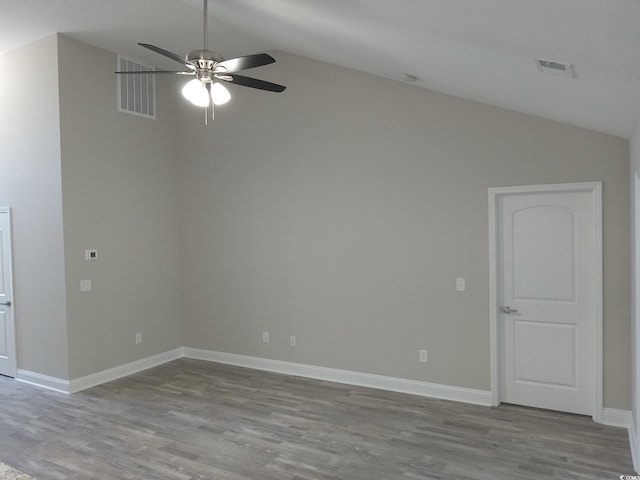 unfurnished room with ceiling fan, lofted ceiling, and light hardwood / wood-style flooring