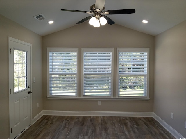 interior space with ceiling fan, dark hardwood / wood-style flooring, and lofted ceiling